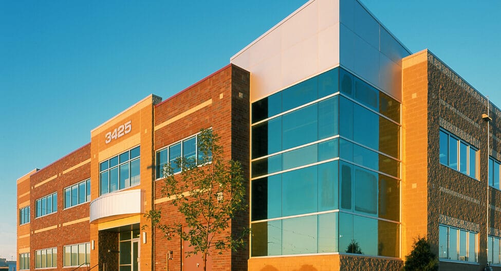 An exterior image of a commercial office building in Rochester, Minnesota where an Ellie Mental Health Therapy and Psychiatry Clinic is located.