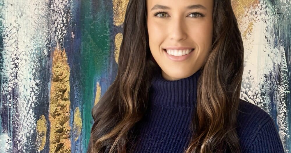 Headshot of Breanna Heaney dressed in a dark turtleneck sweater.