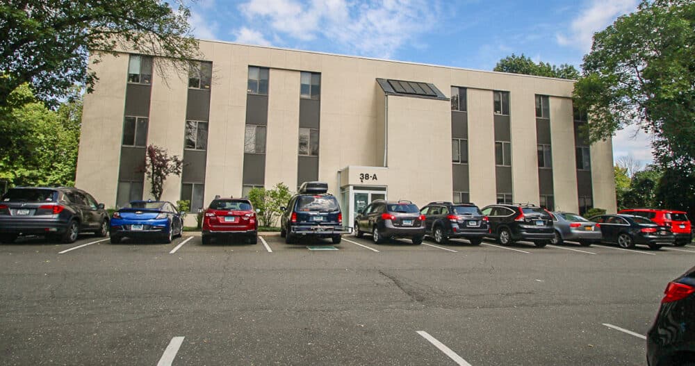 An exterior image of a commercial office building in Ridgefield, Connecticut where an Ellie Mental Health Therapy Clinic is located.