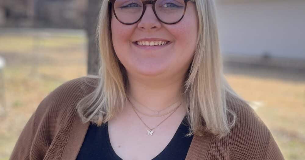 Headshot of Bridget Allen, Therapist at Ellie Mental Health, wearing a dark shirt and tan sweater.