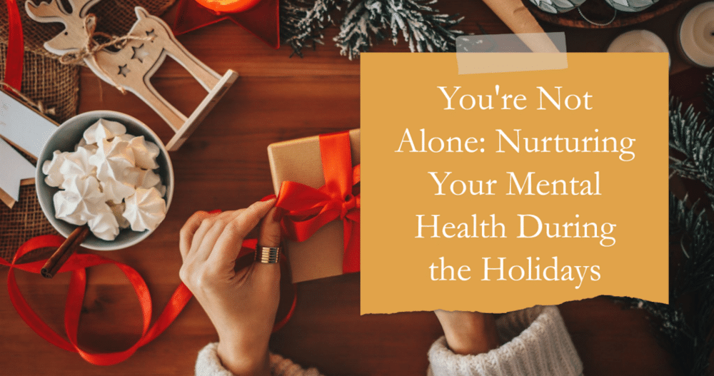 Birds eye view of a table with christmas themed items and a woman wrapping a present