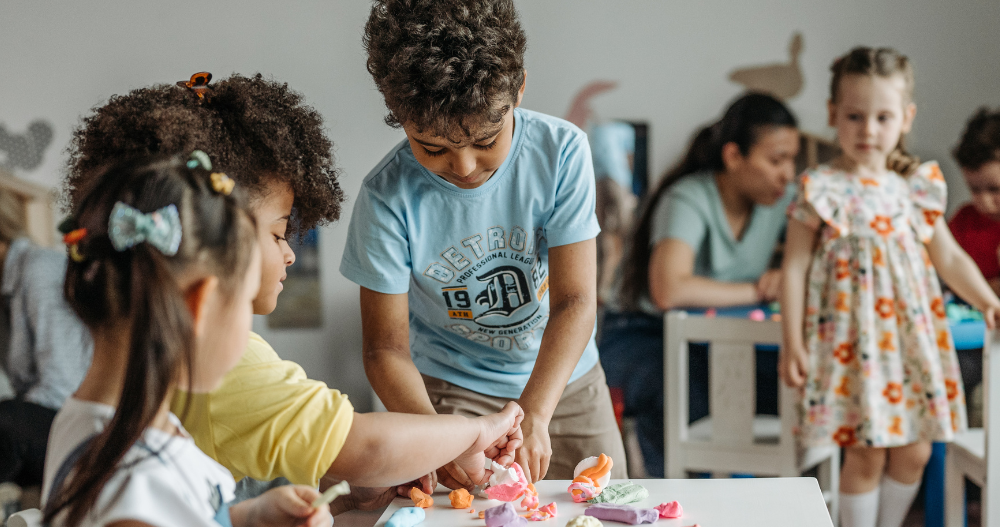 A group of kids doing arts and crafts together in school